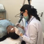 Dr-Rini-performing-the-carbon-blackout-laser-treatment-on-a-patient-150x150 Gallery